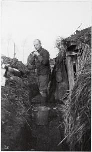 Major Graham Chaplin dressing in trenches outside Armentieres, 1915 (photo by Fred Davidson)